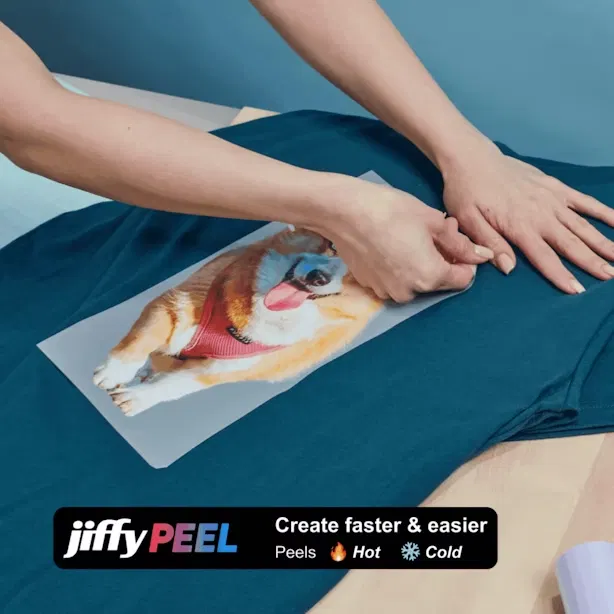 Hands applying DTF transfer